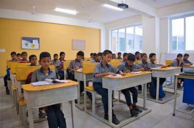 A group of children sitting at desks in a classroom