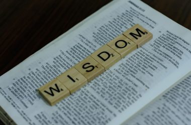 a scrabbled word spelling the word w is down on top of a