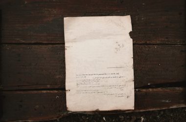 white printer paper on brown wooden surface