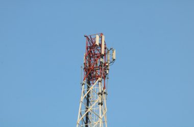 a cell phone tower with a blue sky in the background