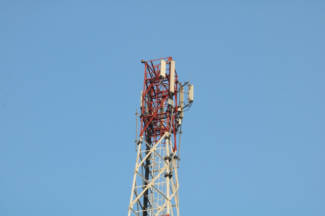 a cell phone tower with a blue sky in the background