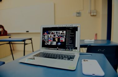 macbook pro on blue table