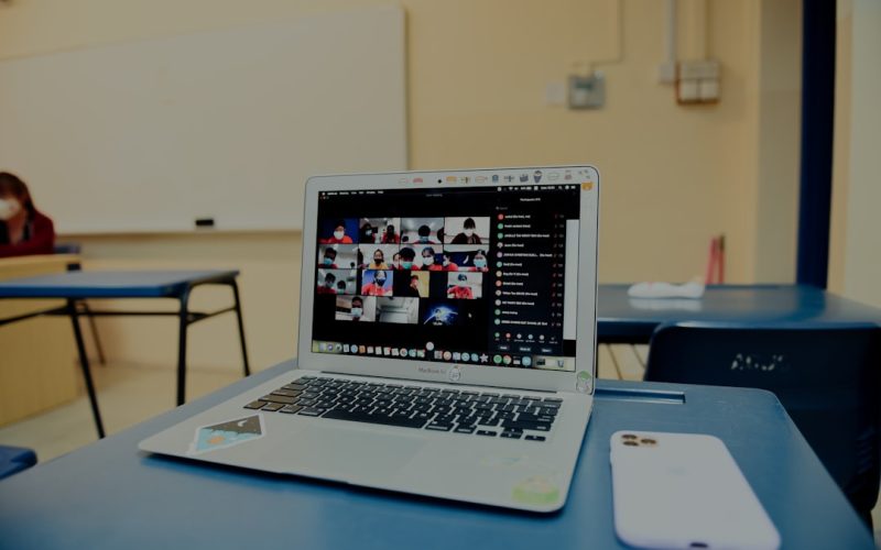 macbook pro on blue table