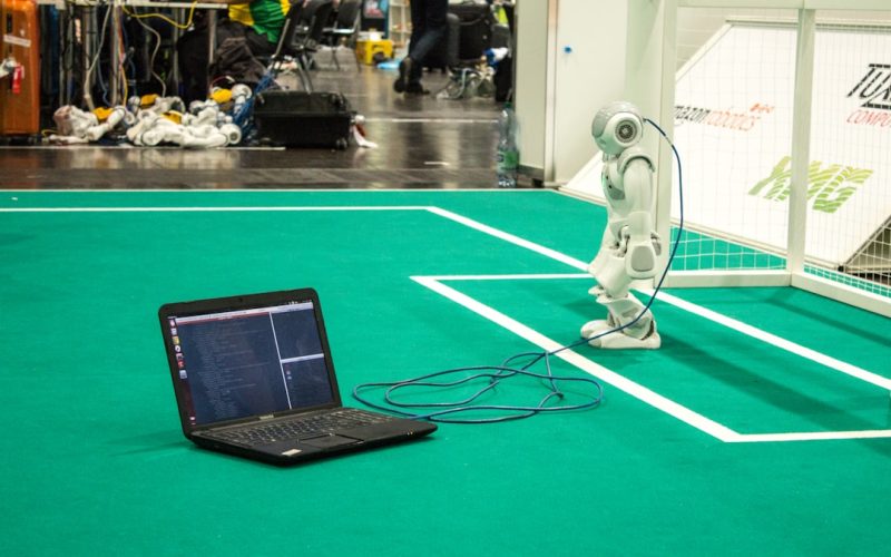 black tablet computer on green table