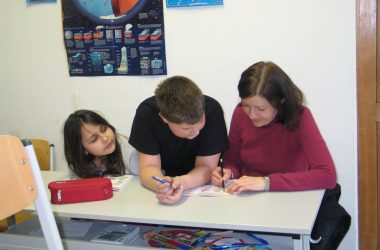 a group of people sitting at a table