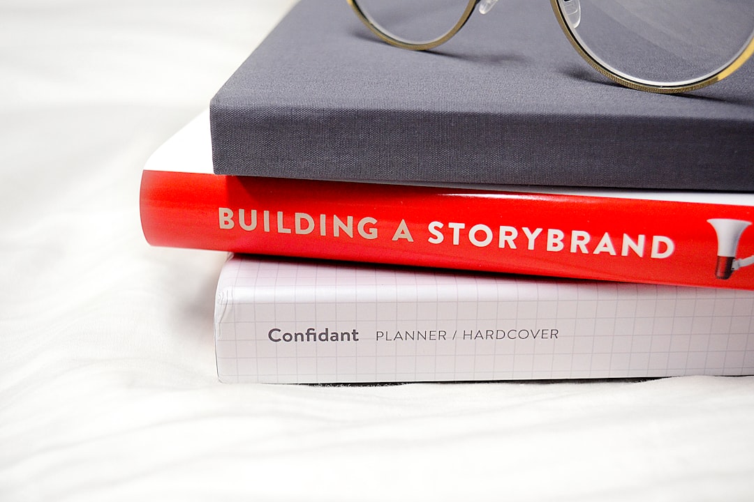 gold framed eyeglasses on black hardbound book