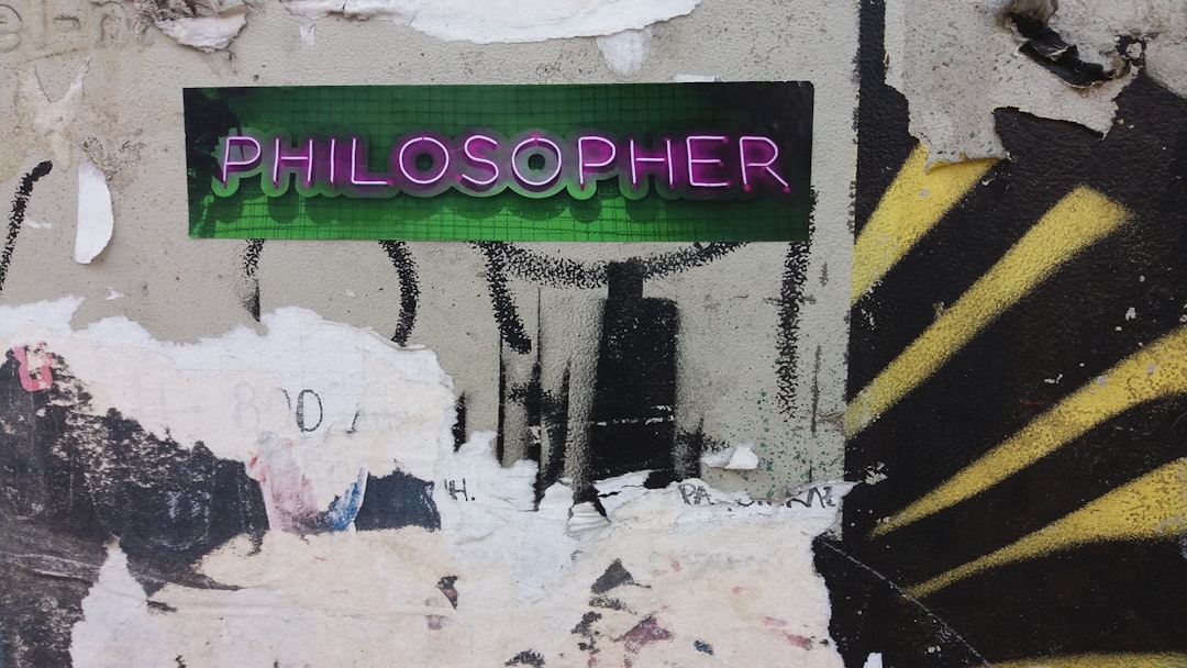 a close up of a street sign on a wall