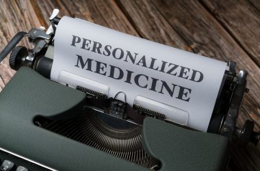 a typewriter with a paper that reads personalized medicine