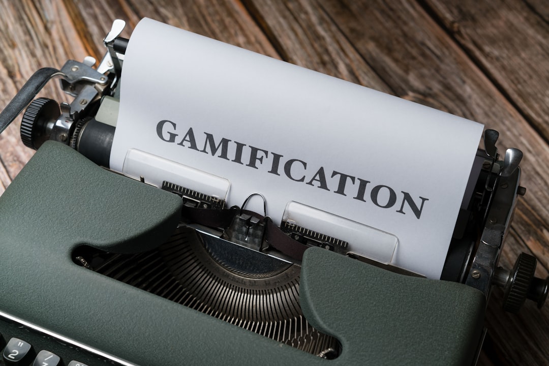 a close up of a typewriter with a paper that reads gamification