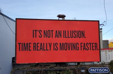 a large red billboard with a quote on it