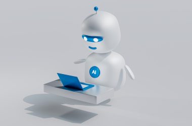 a white robot with blue eyes and a laptop