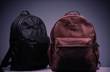 black and brown backpack on white textile