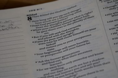 a close up of a book with a poem on it