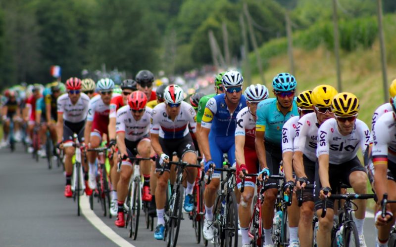 group of men riding bicycle