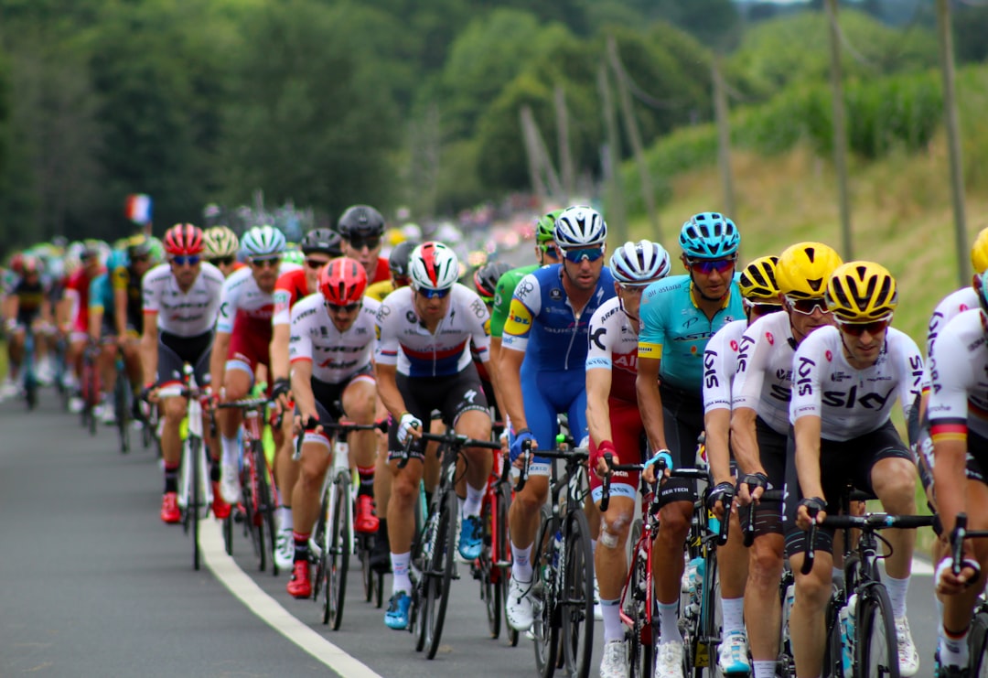 group of men riding bicycle