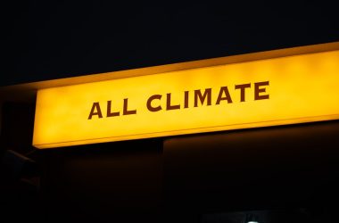 a yellow sign that says all climate on it