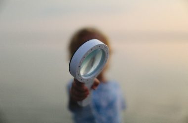 a person holding a white disc