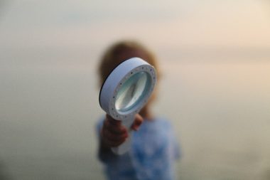 a person holding a white disc