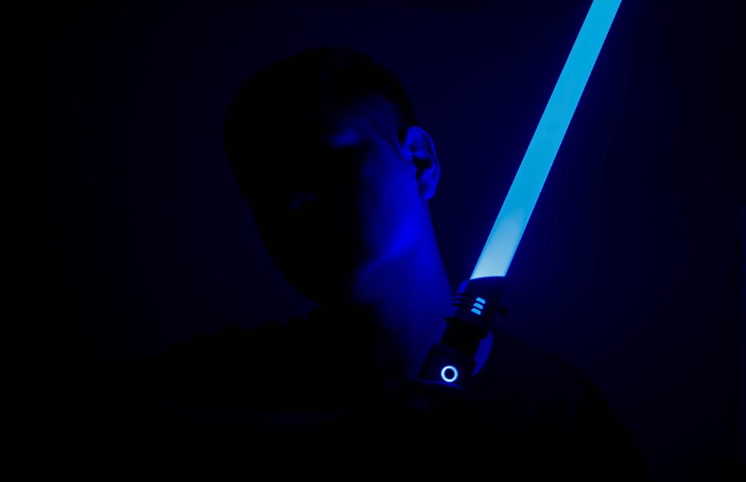 person holding light sabe