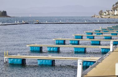 a dock with blue and white containers