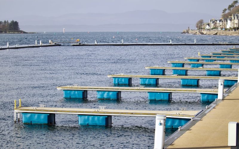 a dock with blue and white containers