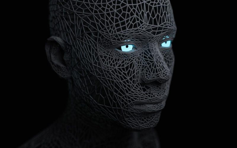 a man with blue eyes and a black background
