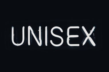 a neon sign that reads unisex