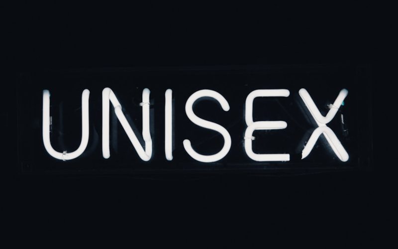 a neon sign that reads unisex