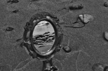 a reflection of a landscape in a mirror