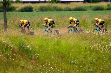 bicycle racing on green grass field during daytime