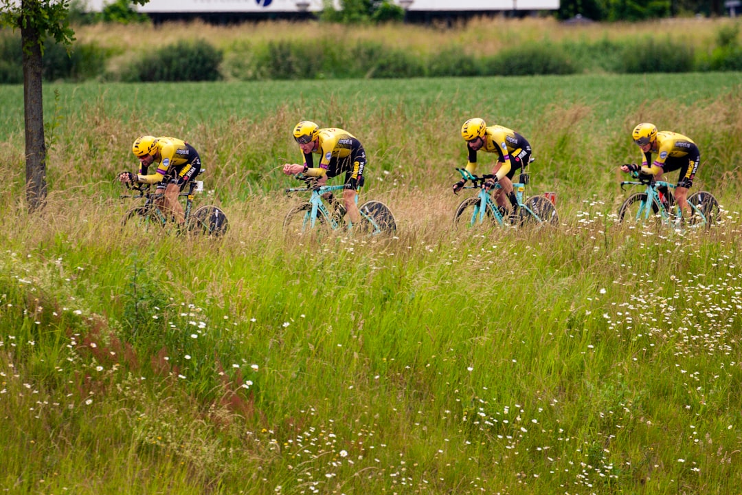 bicycle racing on green grass field during daytime