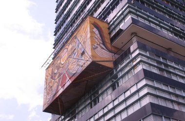 A modern high-rise building with artistic design.