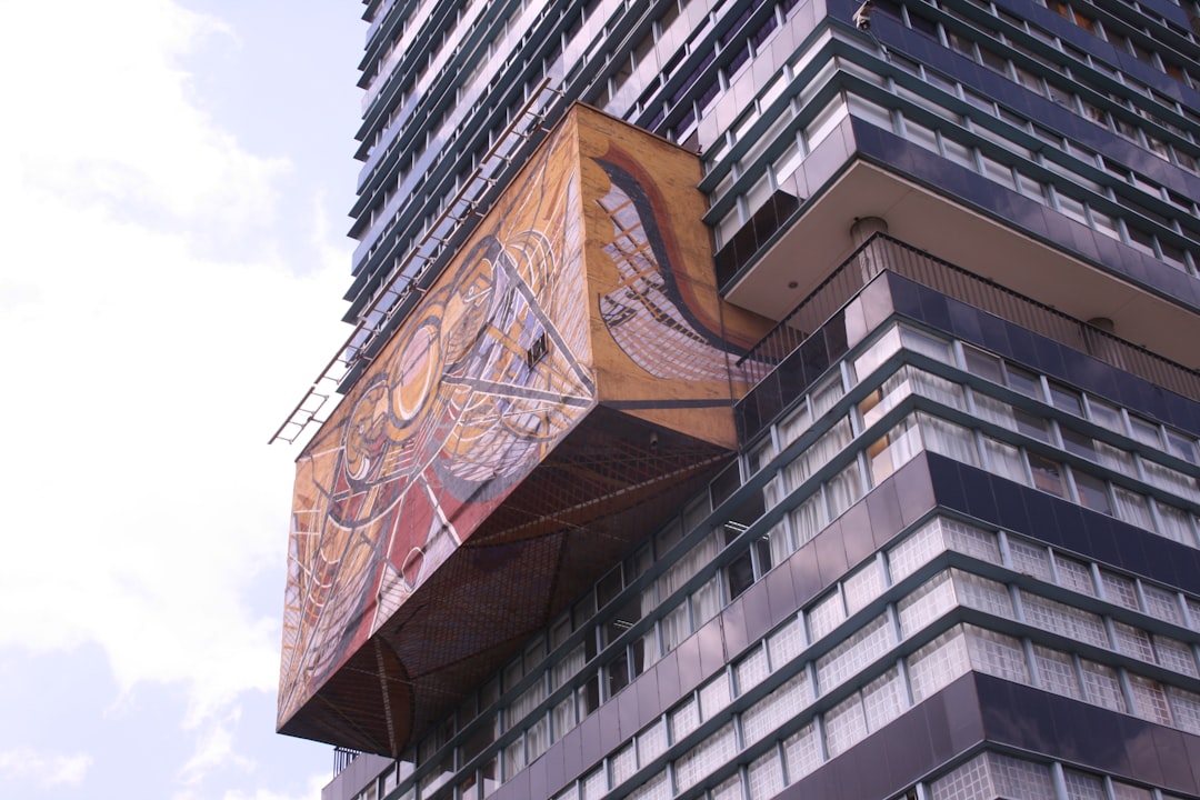 A modern high-rise building with artistic design.