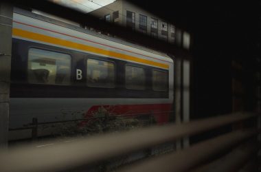 A train waits in the station at night.
