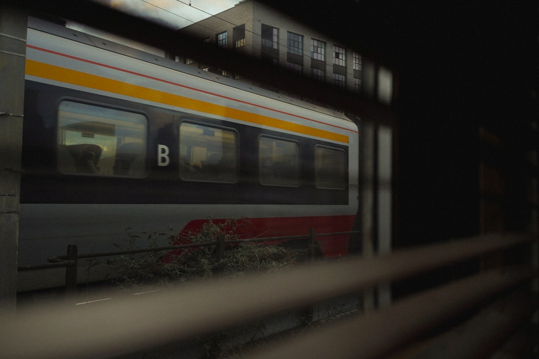 A train waits in the station at night.