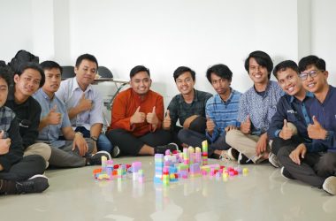 a group of men sitting next to each other