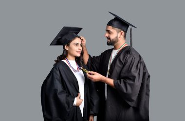 a man and woman wearing graduation gowns and caps