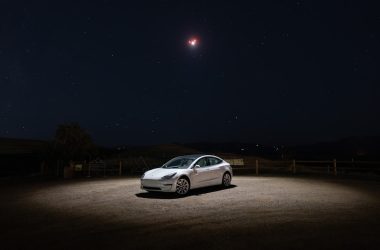 a car parked in a dirt lot