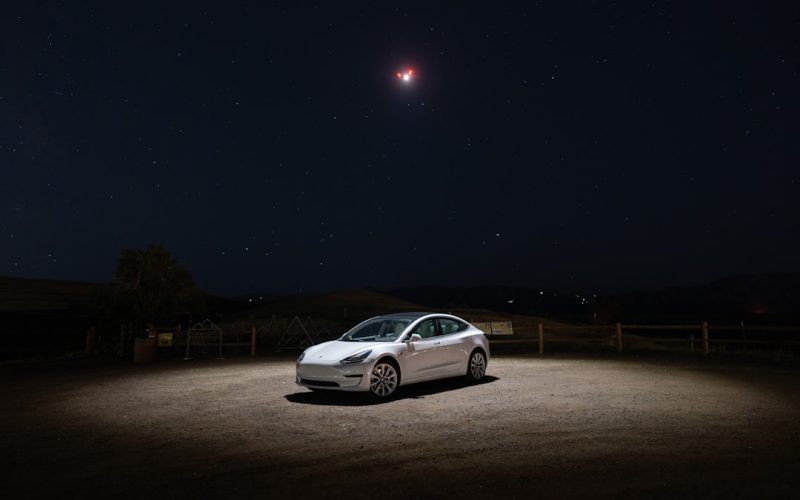 a car parked in a dirt lot