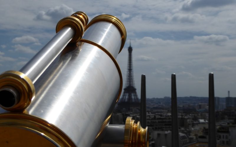focus photography of telescope on Eiffel Tower, Paris