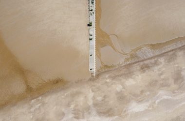 white wooden dock on white sand
