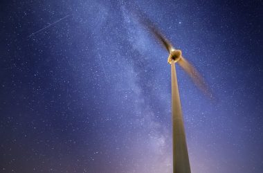 white and black wind turbine under blue sky