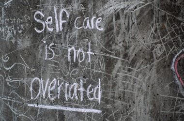 white and black quote on gray wall