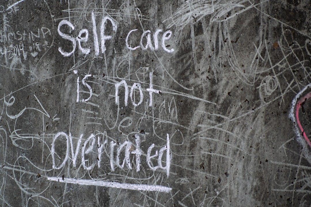 white and black quote on gray wall