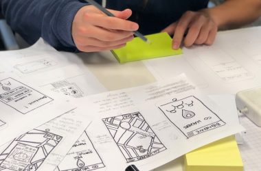 person writing on white paper