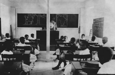 a black and white photo of students in a classroom