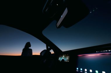 a person sitting in a car at night
