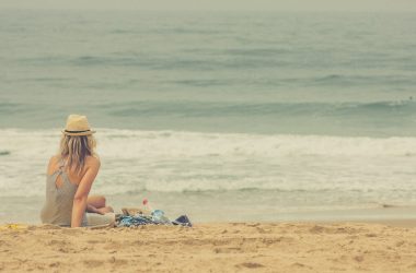 woman sitting on seashore