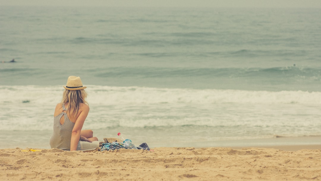 woman sitting on seashore