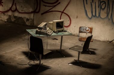 white laptop computer on table
